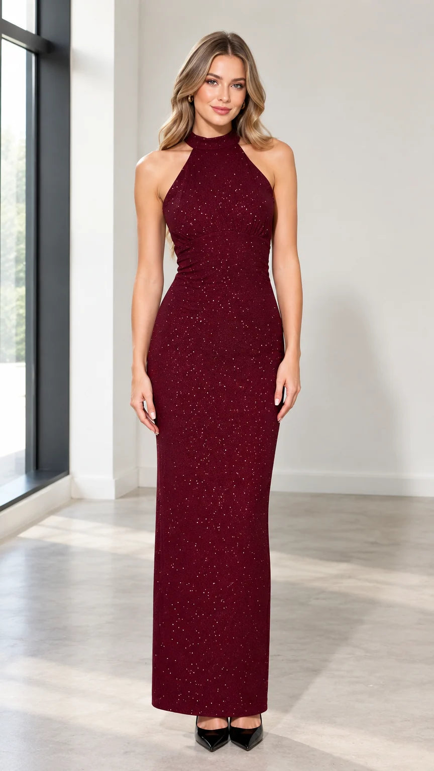 Front view of woman wearing burgundy shimmer halter neck maxi evening gown