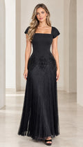 Front view of black square neck cap sleeve evening dress with beaded waist and fringe maxi skirt