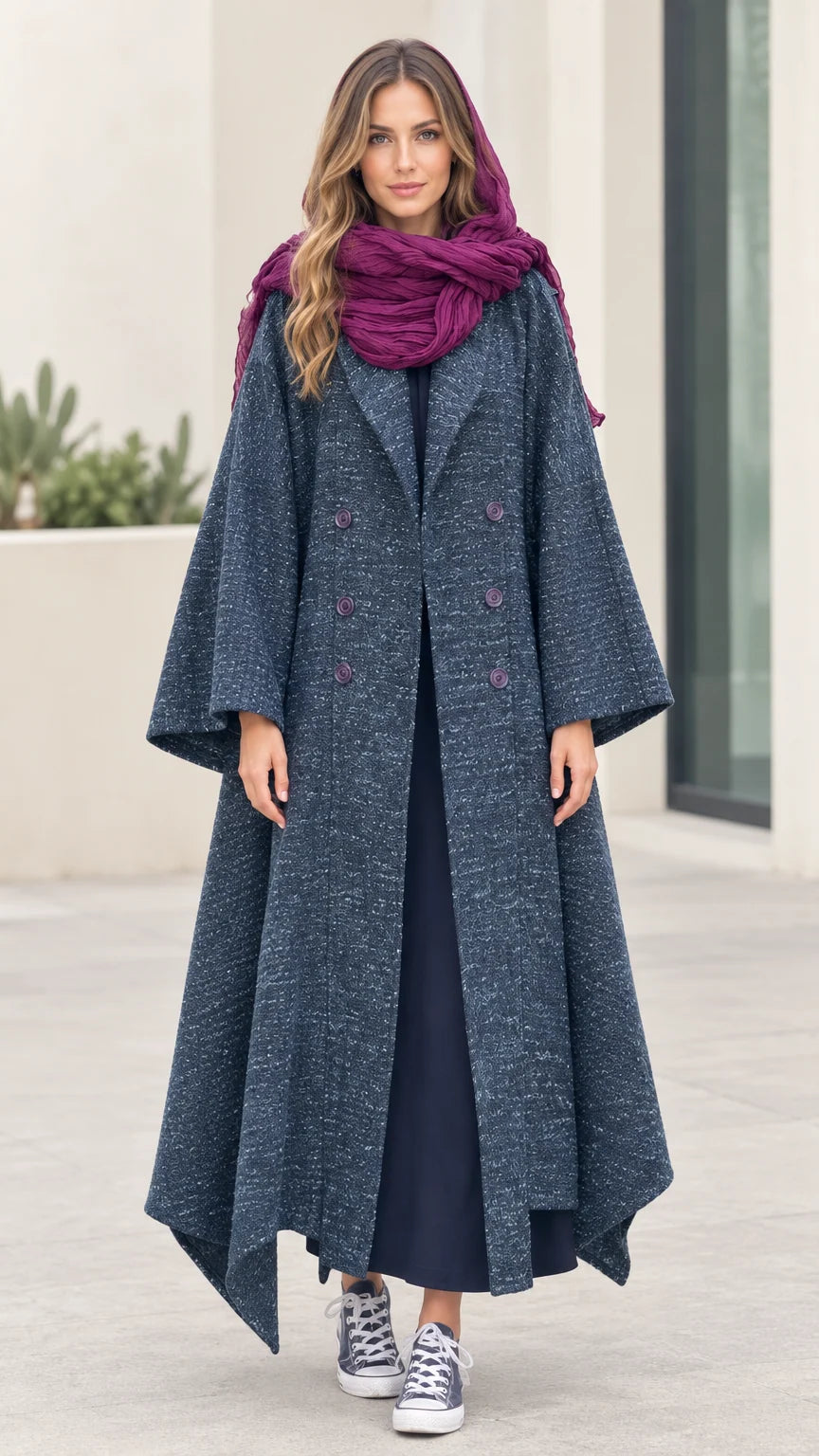 Front full-length view of woman wearing Slate Blue textured tweed maxi coat with flared handkerchief hem