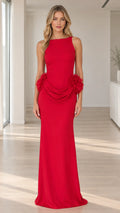 Front view of model wearing sleeveless red maxi gown with boat neck and draped floral hip details
