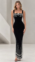 Front view of black square neck maxi evening gown with crystal bodice embellishment and beaded fringe hem