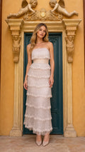 Front view of champagne tiered beaded strapless maxi dress