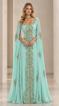 Front view of model wearing mint green embroidered cape sleeve kaftan evening gown