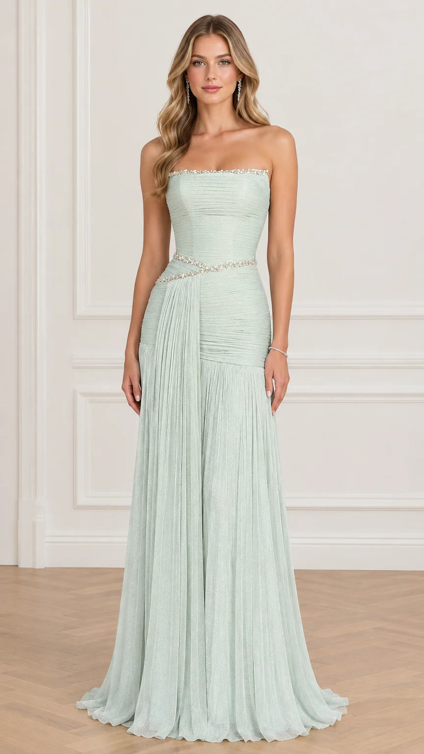 Front view of model wearing sage green strapless pleated evening gown