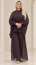 Front view of woman wearing Plum chiffon cape top and wide-leg pant set with sequin mock neck