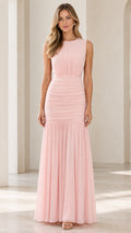 Front view of woman wearing blush pink sleeveless ruched maxi evening dress