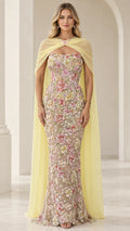 Pastel yellow floral embroidered strapless evening gown with sheer chiffon capelet front view