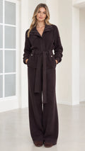 Front view of woman wearing dark brown ribbed knit belted jacket and wide-leg pants set