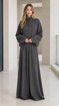 Front full view of woman wearing charcoal grey zip-up mock neck jacket and wide-leg lounge pants set