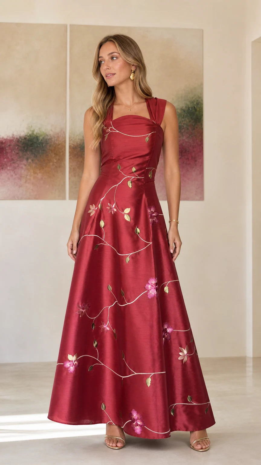 Front view of model wearing burgundy embroidered floral maxi dress