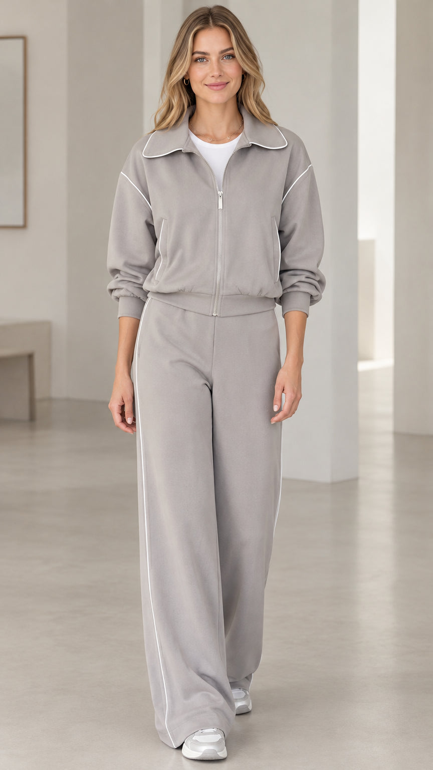 Full front view of model wearing Heather Grey two-piece zip-up tracksuit set with wide-leg pants