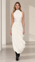 Front view of model wearing ivory sleeveless high neck ruched draped maxi dress