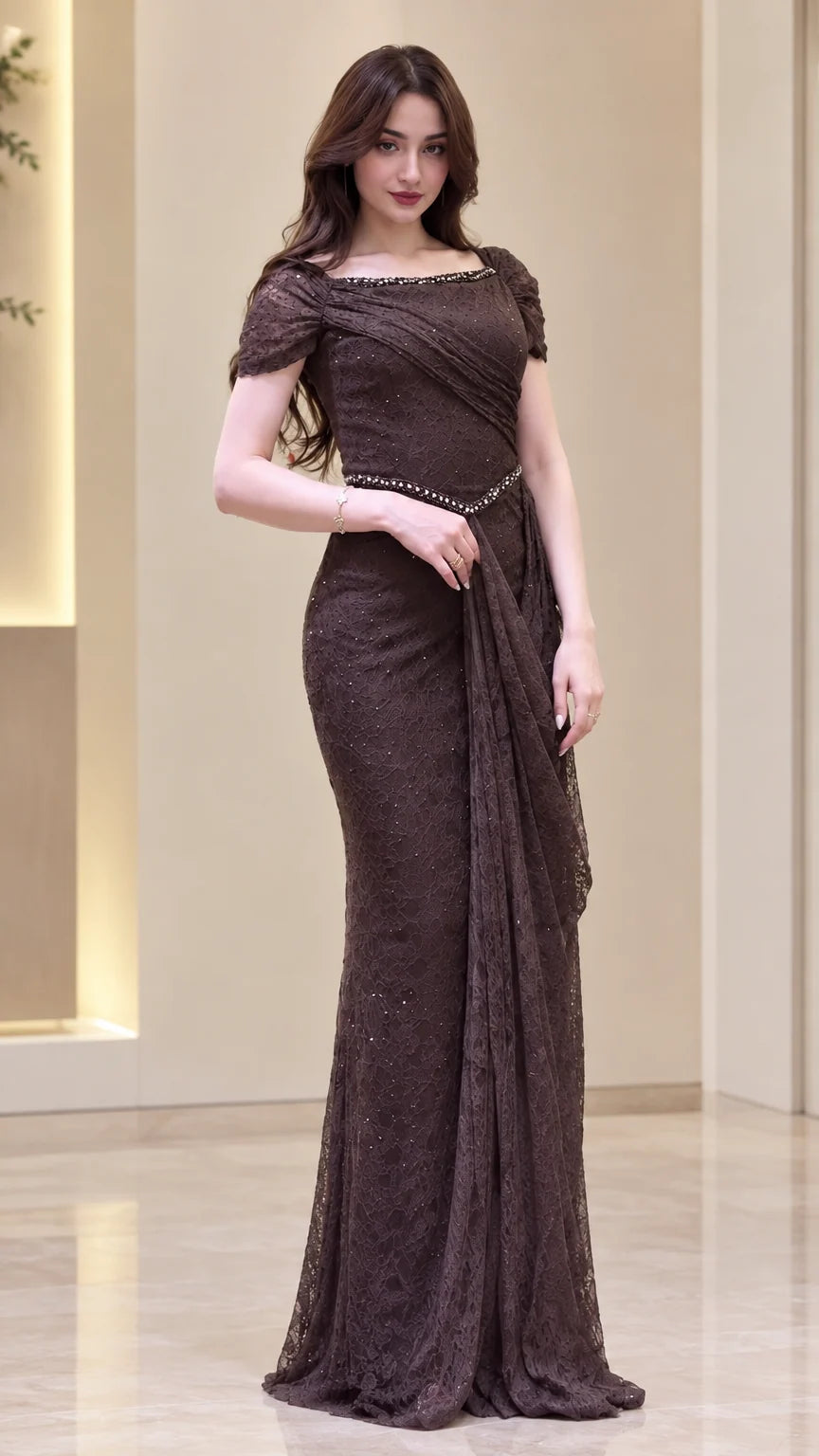 Front view of model wearing Chocolate Brown lace evening gown with beaded neckline and draped waist
