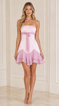 Front full view of model wearing pink two-tone strapless mini dress with ruffled hem