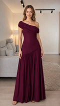 Front view of woman wearing burgundy one-shoulder pleated maxi dress