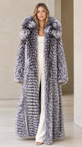 Front view of woman wearing silver grey full-length hooded faux fur maxi coat
