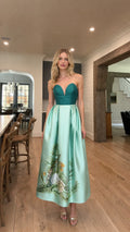 Front view of model wearing teal and mint two-tone strapless evening dress