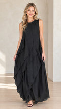 Front view of model wearing black sleeveless tiered maxi dress