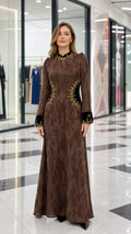 Front full view of brown textured long sleeve maxi dress with embroidered velvet trim