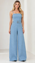 Front view of model wearing a light blue square neck sleeveless belted wide-leg jumpsuit