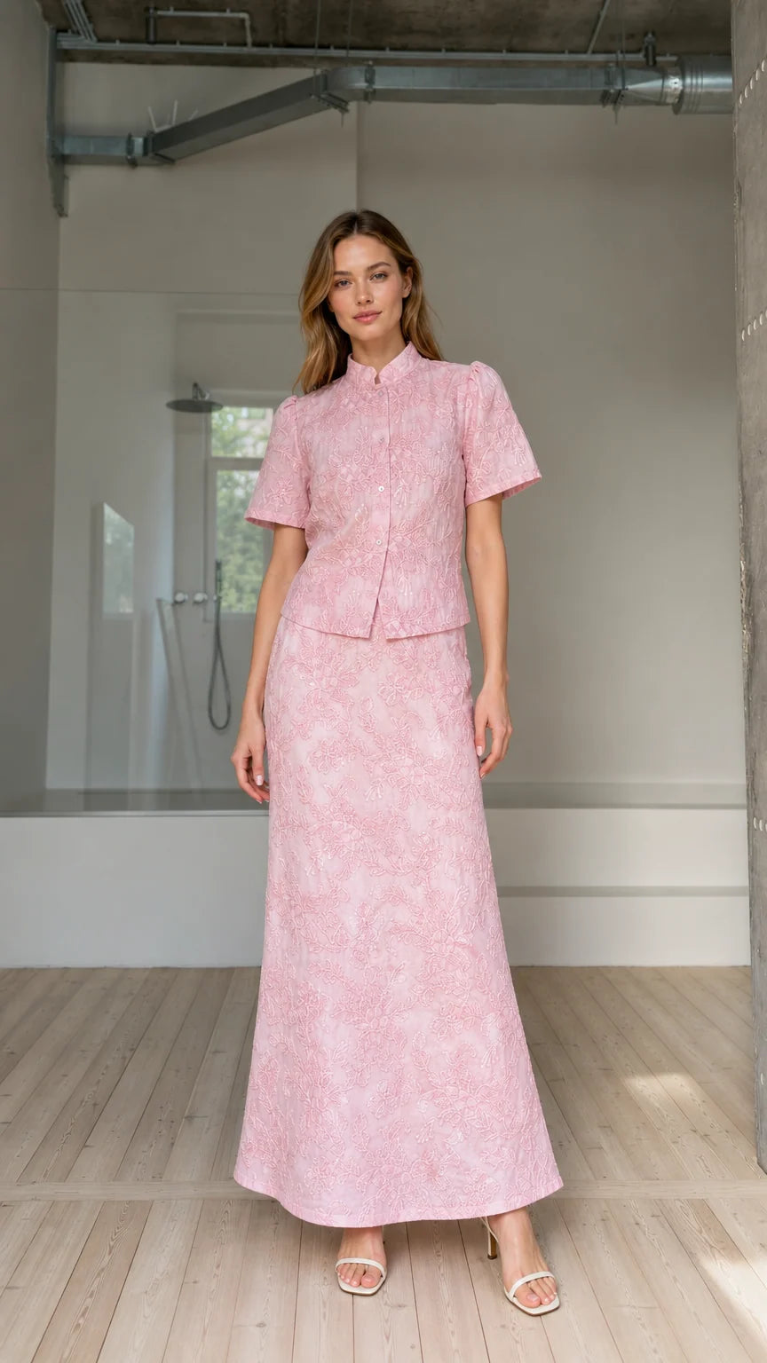 Front view of model wearing pink floral embroidered short-sleeve top and maxi skirt set
