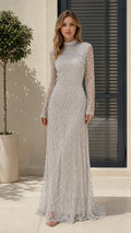 Front view of model wearing silver sequin beaded high neck evening gown