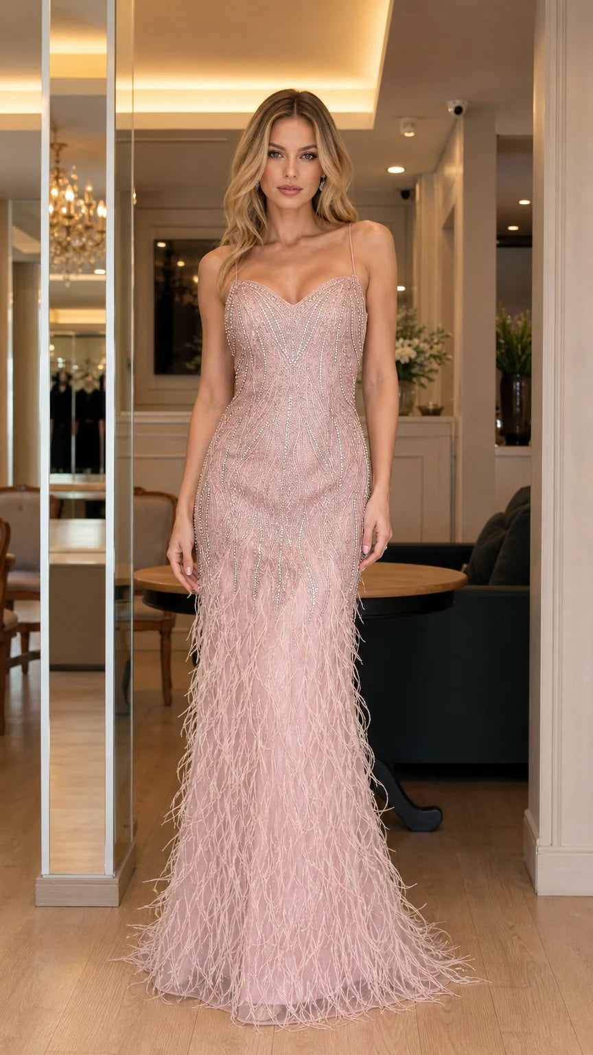 Front view of pink feathered evening gown