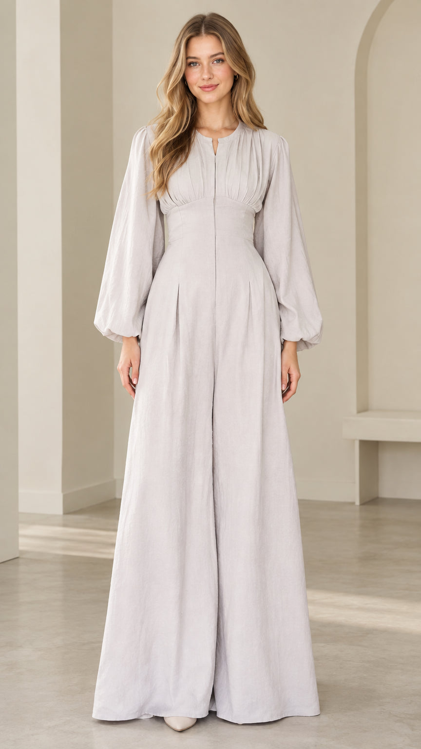 Front view of model wearing dove grey lantern sleeve wide leg jumpsuit