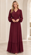 Front full view of woman wearing burgundy long sleeve beaded maxi dress with belt