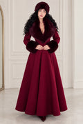 Front view of woman wearing elegant burgundy maxi swing coat with faux fur collar and cuffs
