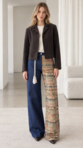 Full front view of model wearing espresso brown cropped button-down jacket with wide-leg pants