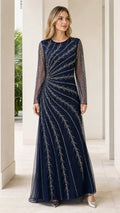 Front view of woman wearing navy blue long sleeve beaded formal maxi gown