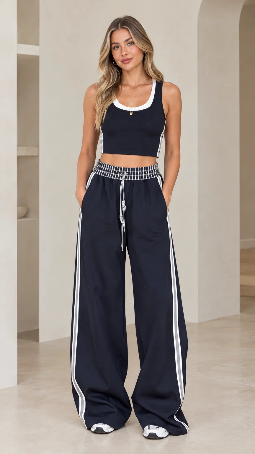 Front view of model wearing Navy Blue crop tank and wide-leg track pants set