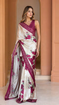 Front view of cream floral satin saree with berry border and sleeveless blouse