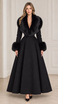 Model wearing long black faux fur collar maxi coat front view
