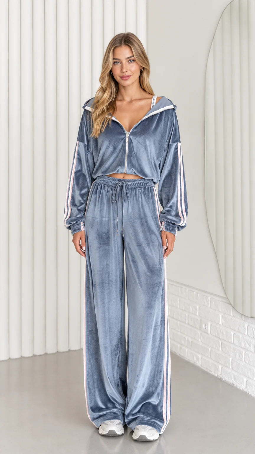 Front view of woman wearing dusty blue velour cropped hoodie and wide leg pants set