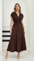 Front full-length view of model wearing chocolate brown ruched waist V-neck midi dress