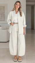 Women's relaxed button-down shirt and wide-leg pants set in cream front view