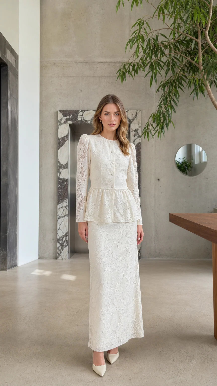 Full front view of model wearing the Cream floral lace peplum top and maxi skirt two-piece set