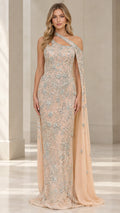 Front view of model wearing champagne embellished one-shoulder lace evening gown with attached cape