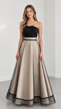 Model wearing Champagne and black strapless embroidered A-line evening gown front view