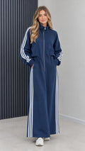 Front view of model wearing navy blue sporty full-zip striped maxi track dress