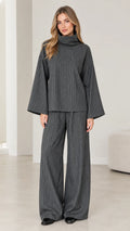 Front view of woman wearing Charcoal Grey pinstripe turtleneck top and wide-leg pants set