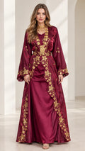 Front view of model wearing burgundy satin embroidered kaftan maxi dress