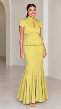 Front full-length view of woman wearing Chartreuse high neck peplum mermaid maxi dress set