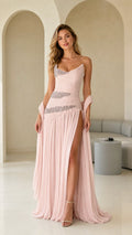 Front view of model wearing blush pink one-shoulder ruched chiffon evening gown with rhinestone accents and slit