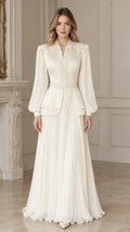 Front full-length view of woman wearing ivory embellished peplum evening dress set with pleated maxi skirt