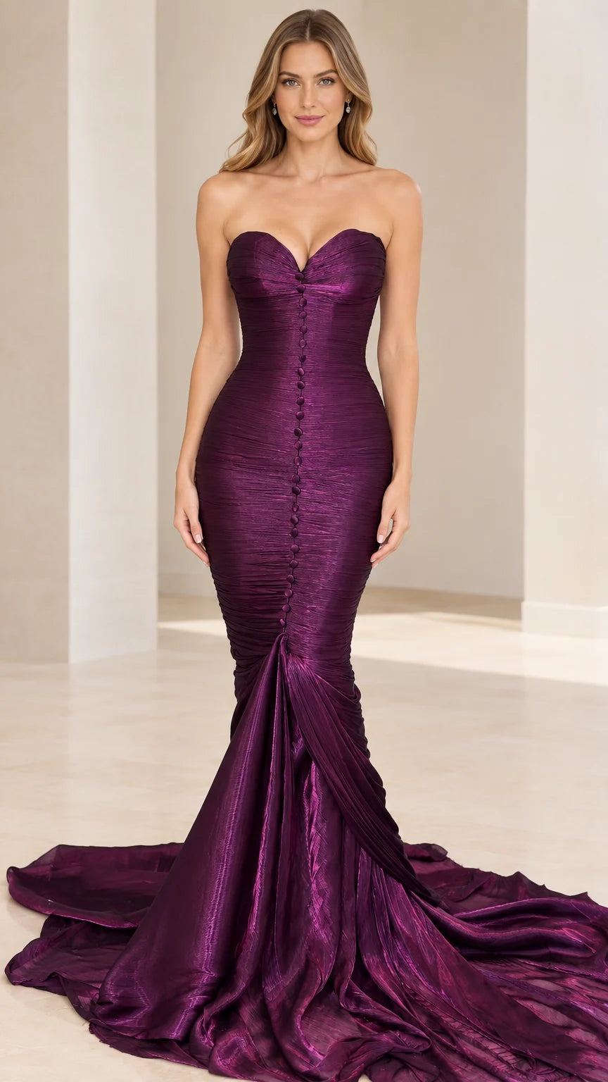 Front view of model wearing purple strapless ruched mermaid evening gown with sweeping train