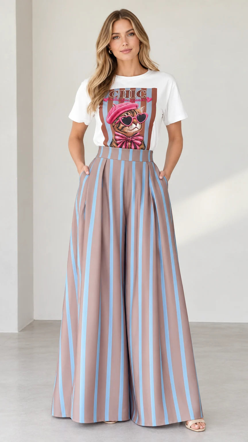 Front view of woman wearing white graphic tee and mocha blue striped wide-leg pants set