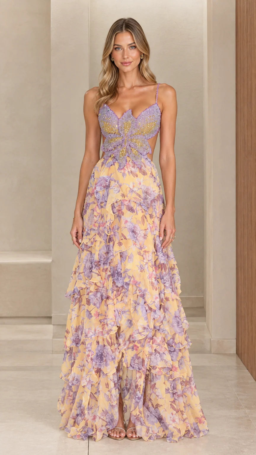 Front view of woman wearing pastel yellow floral chiffon maxi dress with beaded butterfly bodice